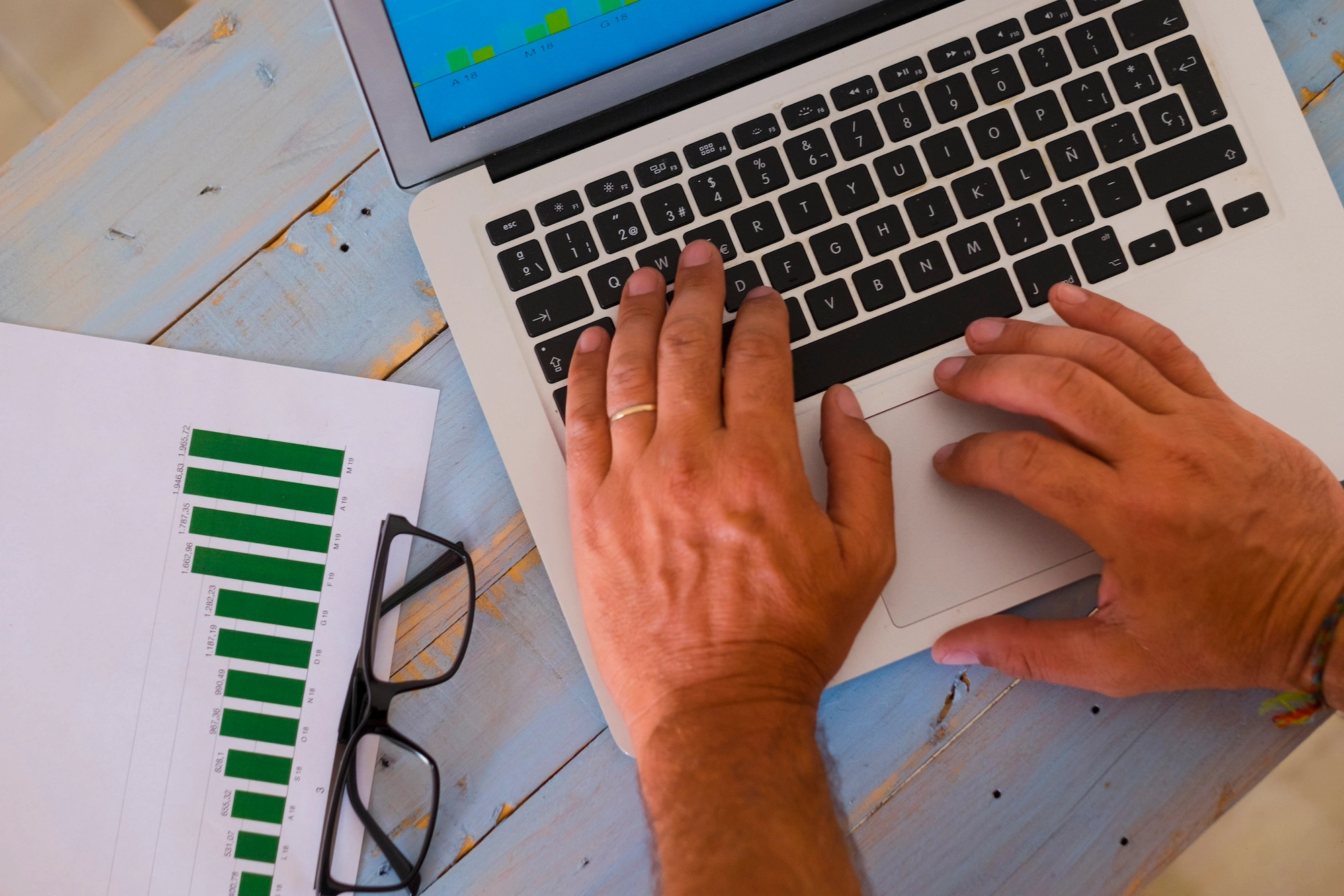 Close up of hands on a keyboard data entry